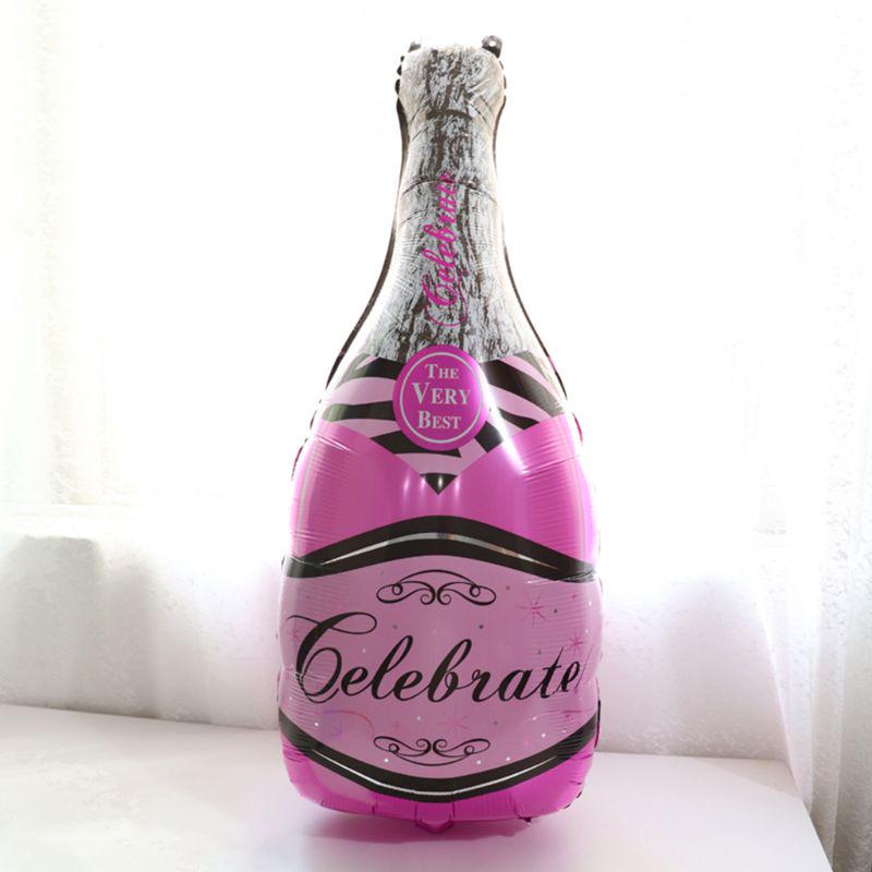 Pink champagne bottle balloon